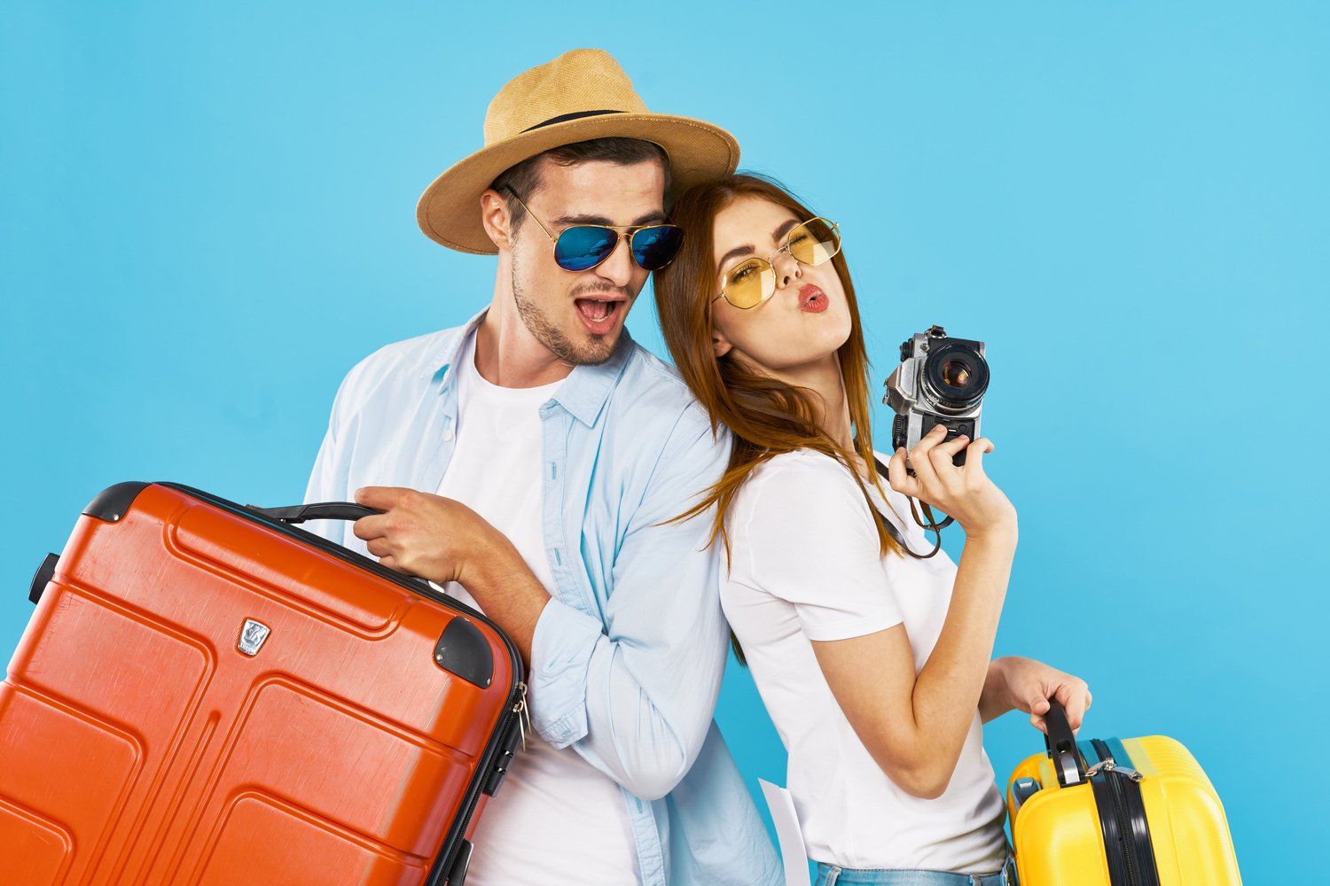 Traveling Couple with Suitcases